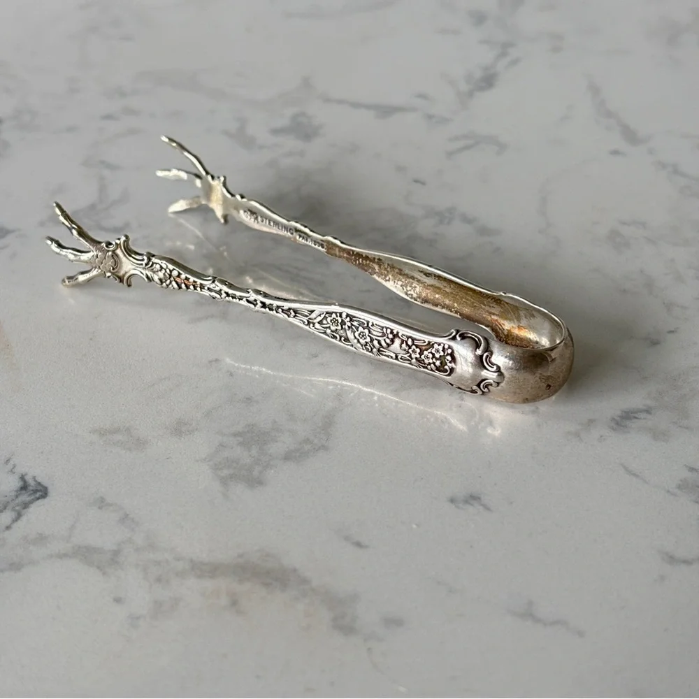 Antique sterling sugar tongs made by Whiting Manufacturing Co